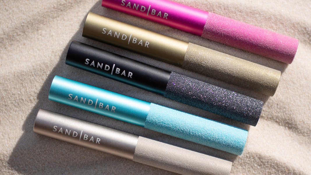Sandbar Callus laying in sand to show off all the colors they offer.
