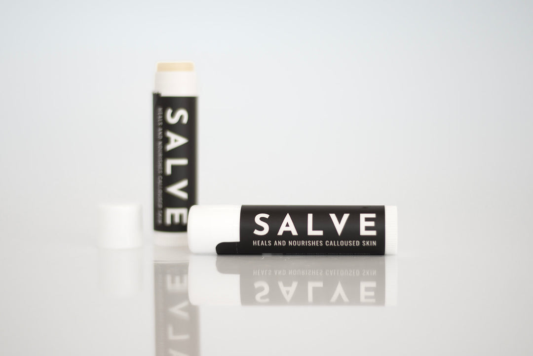 SandBar salve in a chapstick tube that was made to heal callus rips, as well as a recovery tool after you file down your calluses to keep them hydrated.