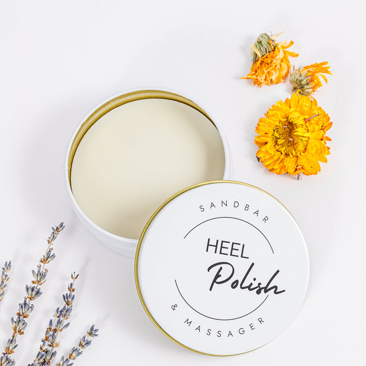 Heel polish with a lid, lavender, and marigold flowers on a white background