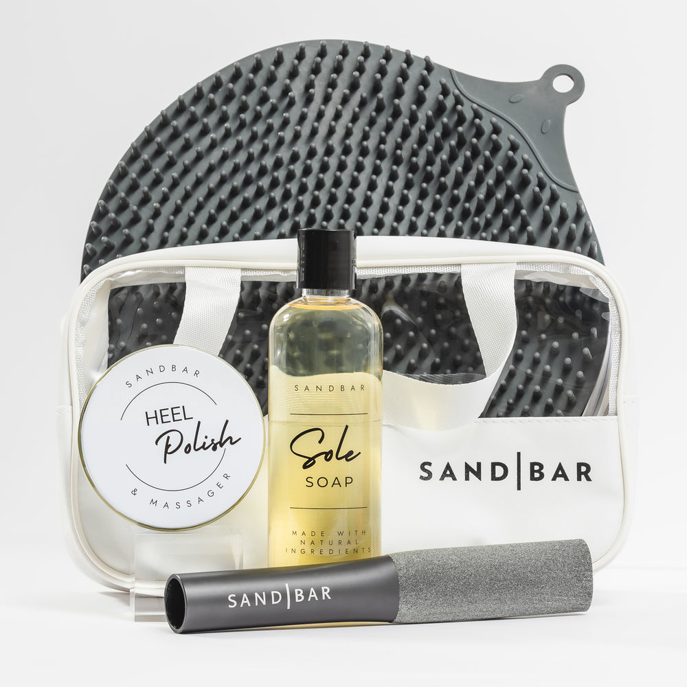 Heel Revival Regimen complete foot care kit with foot scrubber mat, Sole Soap, foot file, Heel Polish, and silicone applicator for smoothing dry cracked heels
