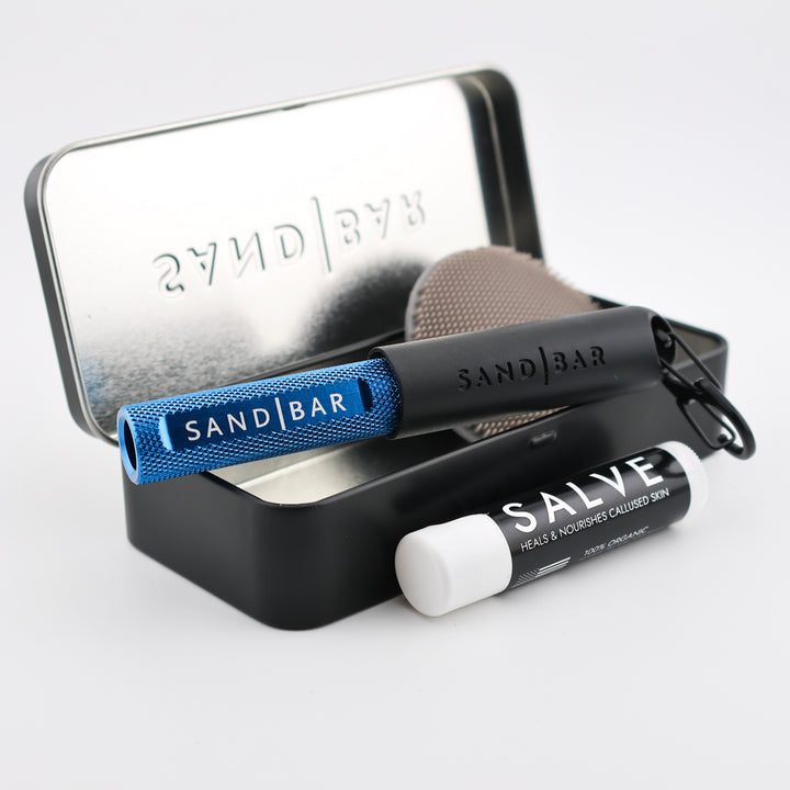 SandBar 4-inch Quickie Callus Kit with cylindrical aluminum file, magnetic cap, salve, scrubber, and tin case