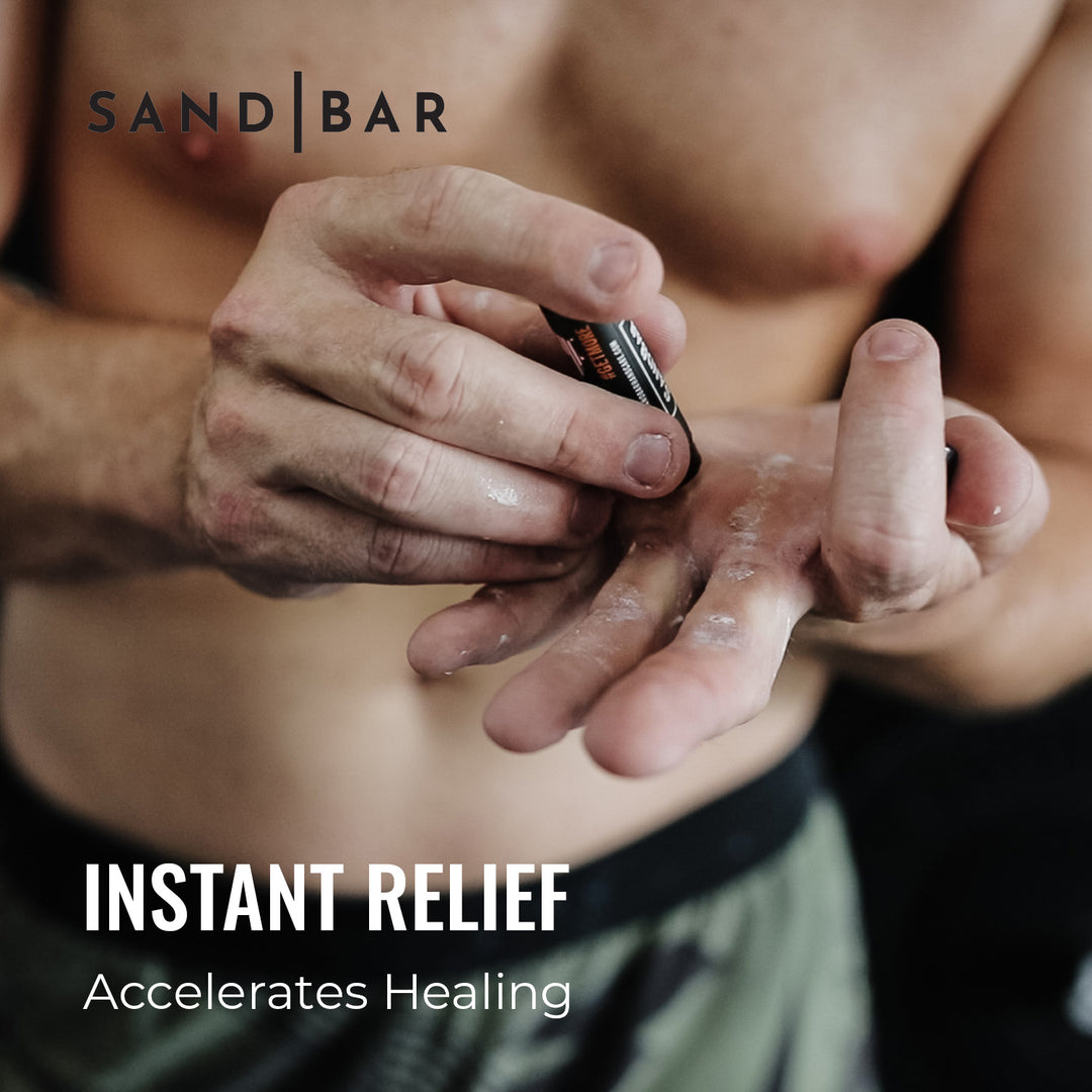 Applying SandBar Salve to calloused hands to prevent cracking and improve grip comfort