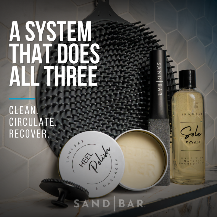 SandBar Athlete Foot Kit with scrubber mat, soap, file, and heel polish displayed on a tile background.