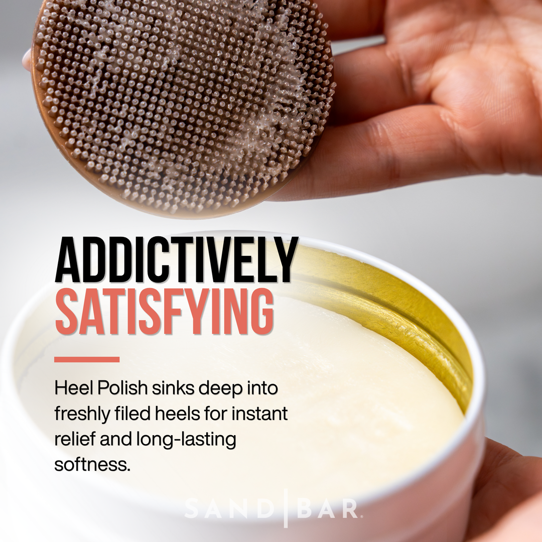 Close-up of SandBar Heel Polish and silicone applicator showing moisturizing balm texture for dry heels.