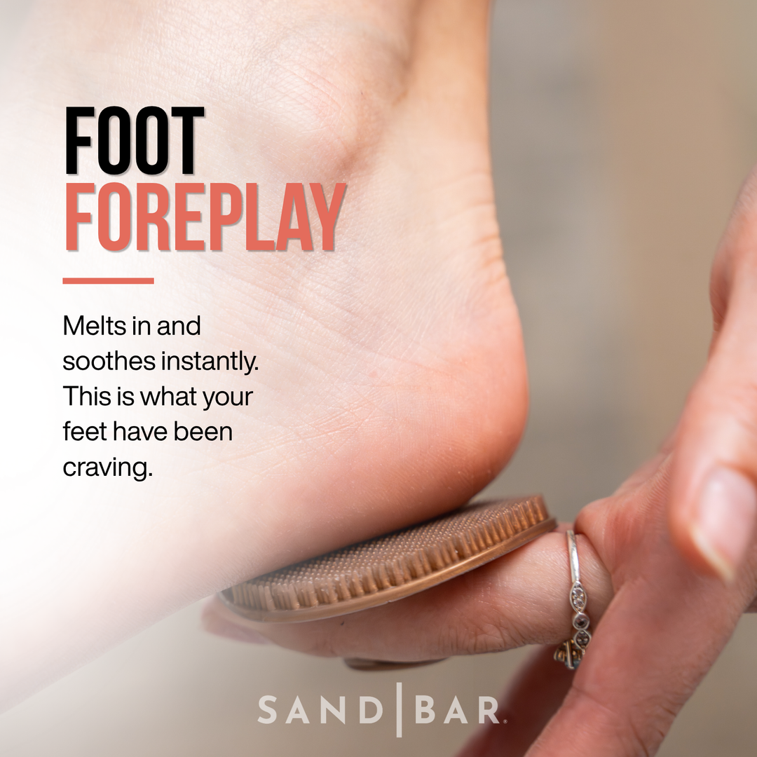 Woman applying Heel Polish with the applicator massaging hydration into heel skin with text reading “Foot Foreplay.”