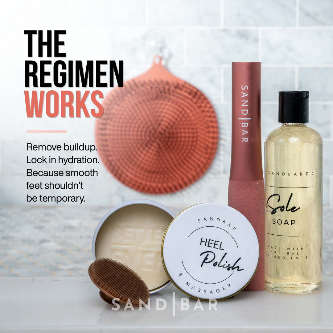 Complete SandBar foot care regimen in copper pink color featuring Heel Polish, Sole Soap, foot file, and scrubber mat, with text that says remove buildup lock in hydration, because smooth feet shouldn't be temporary.