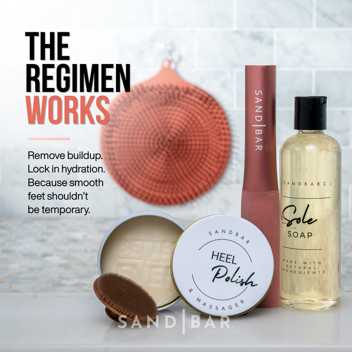 Complete SandBar foot care regimen in copper pink color featuring Heel Polish, Sole Soap, foot file, and scrubber mat, with text that says remove buildup lock in hydration, because smooth feet shouldn't be temporary.