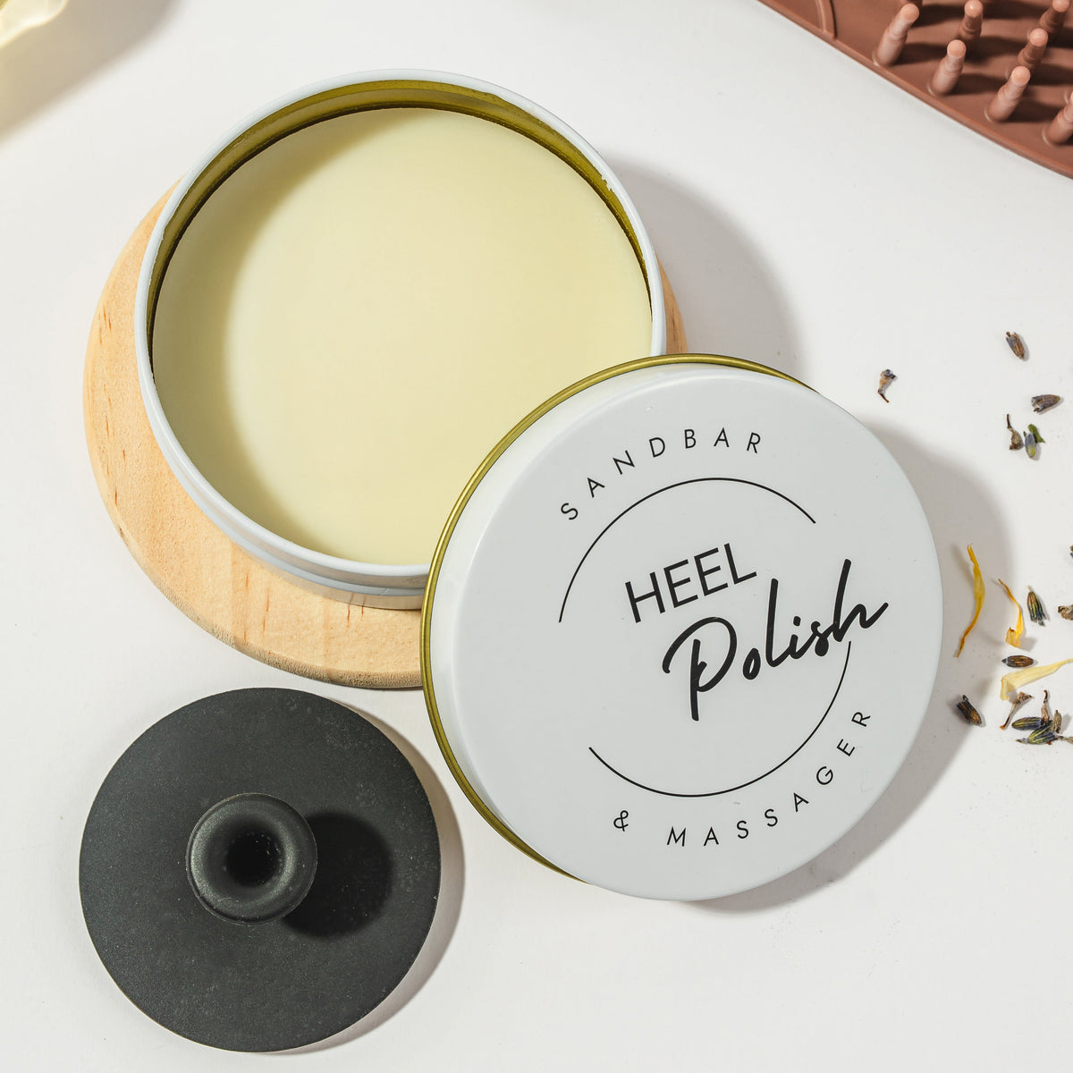 Product image of the Sandbar Heel Polish and the applicator it come with. 100% All Natural Organic Ingredients. 