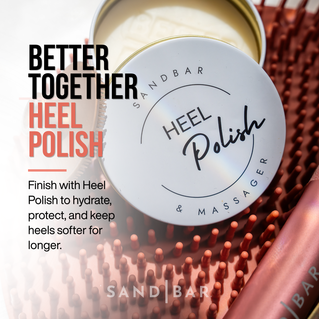 SandBar Heel Polish in a tin, open showing the product, sitting on top of the copper pink foot scrubbing mat and showing the handle of the copper pink foot file. 