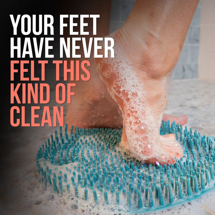 Close-up of a foot covered in rich soap lather on the SandBar silicone foot scrubber mat, illustrating deep cleansing and gentle exfoliation.
