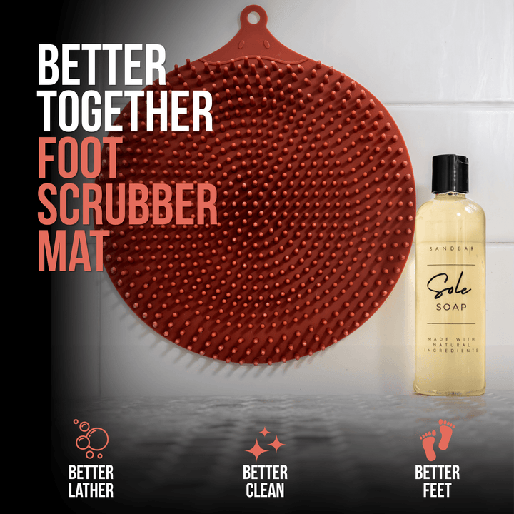 Foot scrubber mat displayed next to a bottle of Sandar Sole Soap, designed to work together for richer lather, a deeper clean, and healthier-feeling feet.
